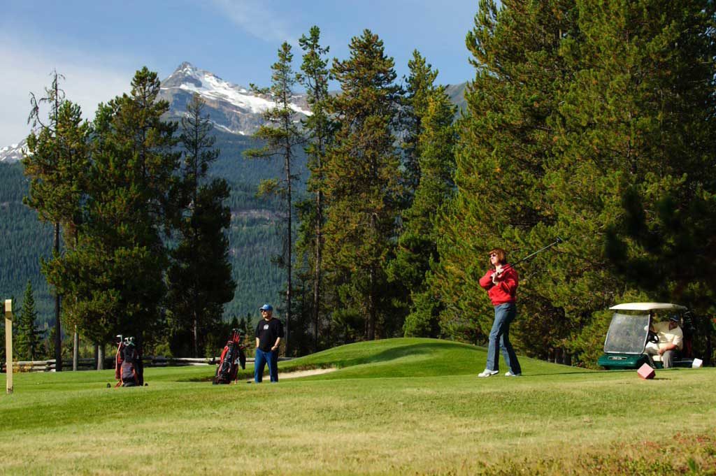 Two men golfing in Valemount, BC.