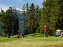 Two men golfing in Valemount, BC.