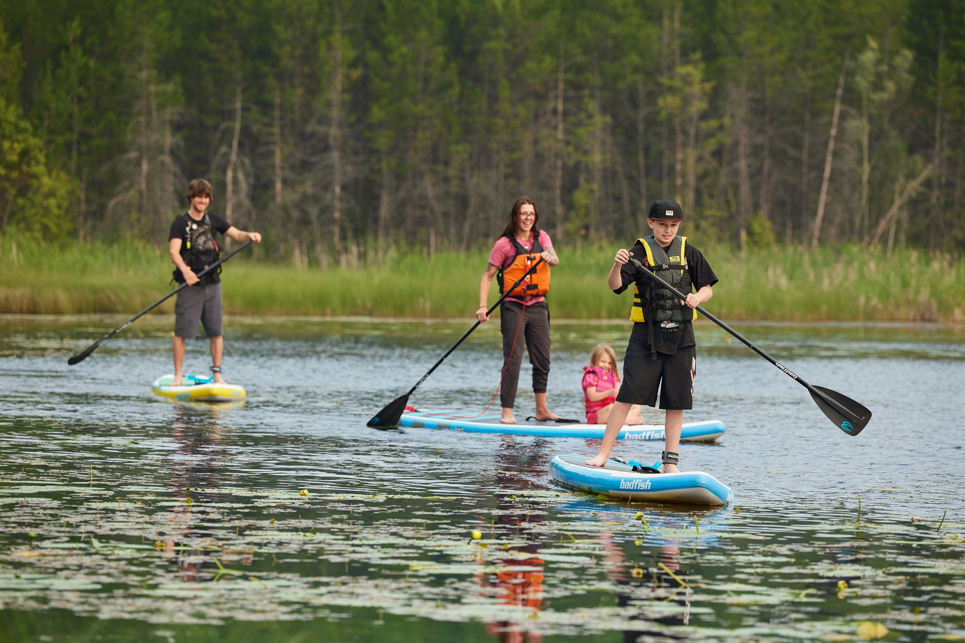 paddle boarding family