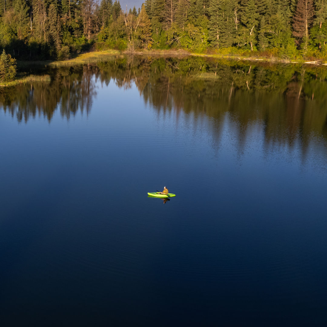 Kayaker in river rapids